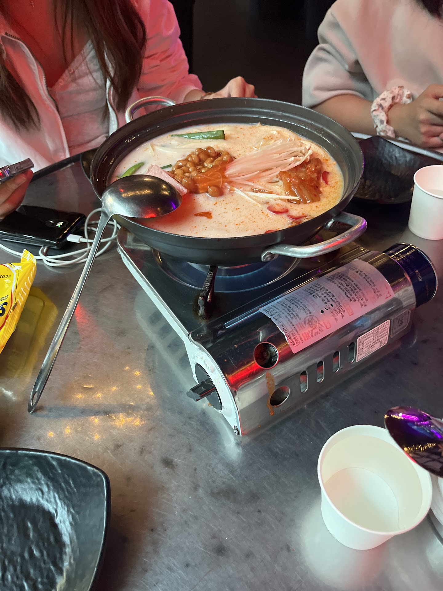 Hot pot simmering at the table