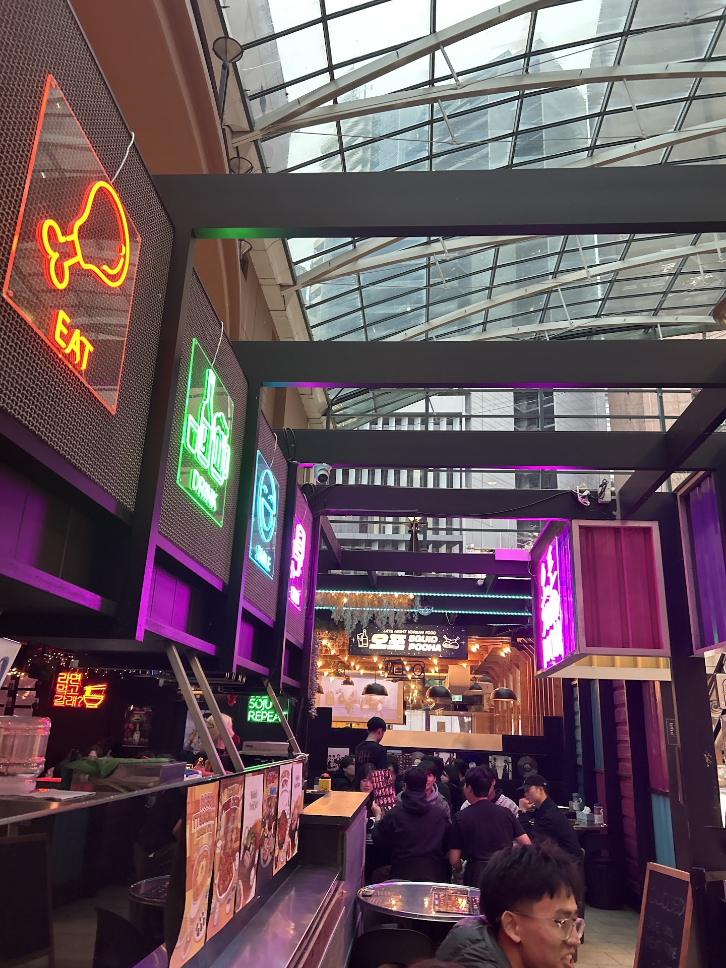 Neon Squid Pocha signage inside Capital Square